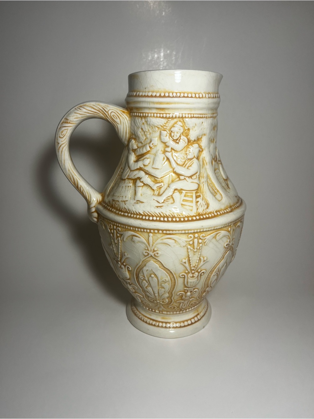 Source Unknown Ivory and Gold Embossed Ceramic Pitcher Vase